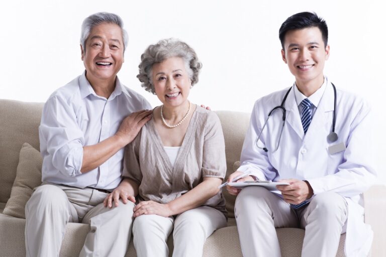 Asian doctor with senior couple