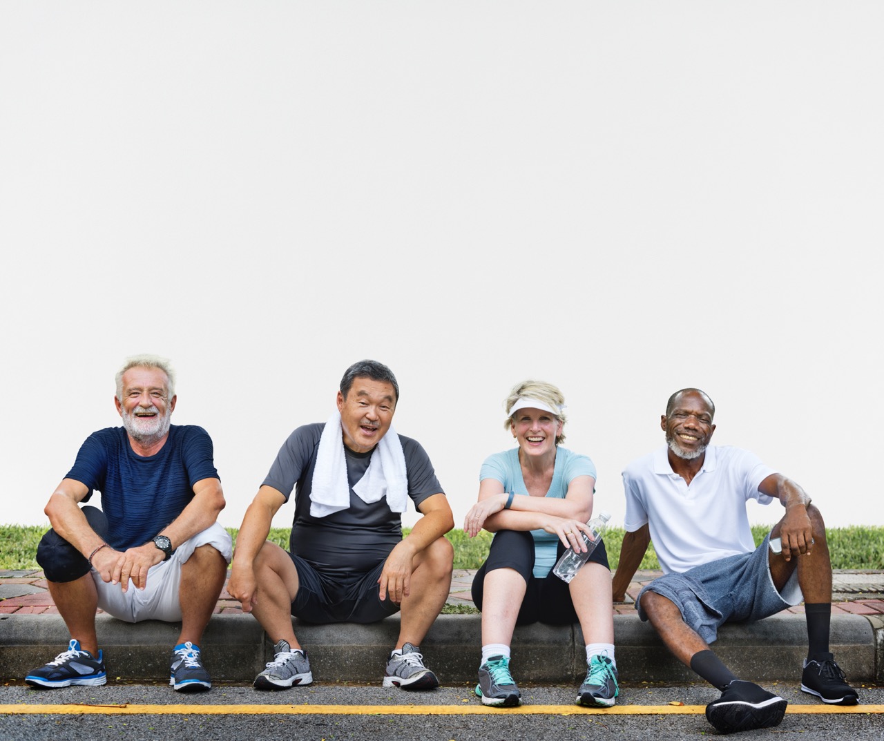 Group of senior friends relaxing together after an exercise